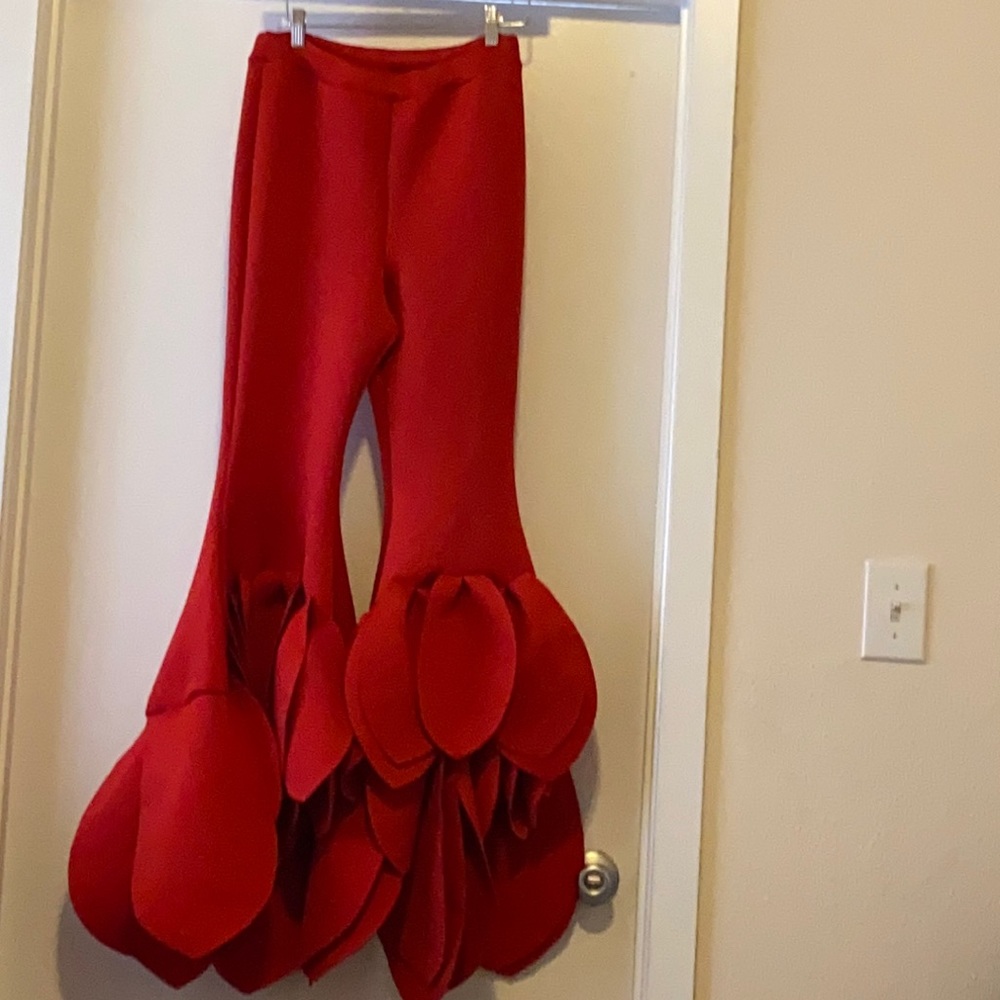 Red “petal” bottom pants.